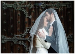 Bride and groom under veil Scottish castle wedding Life in Focus Portraits wedding photos Argyll and Bute