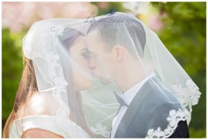 bride and groom kiss under wedding veil Life in Focus Portraits wedding photographer Dunbartonshire