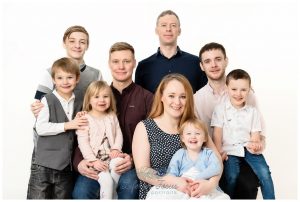 extended family portrait in studio on white background Christmas gift for grandparents Life in Focus Portraits family photography Rhu Helensburgh