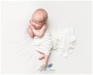 newborn baby boy in white blanket Simply Baby pure and simple newborn photoshoot Life in Focus Portraits newborn baby photographer Rhu Helensburgh
