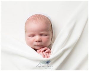 newborn baby boy tucked up in white blanket Life in Focus Portraits Simply Baby newborn portrait sessions Luss Loch Lomond