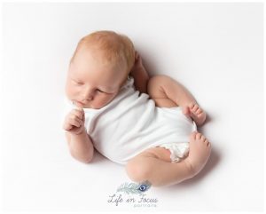 newborn baby in white vest Simply Baby newborn photoshoots Life in Focus Portraits newborn photographer Rhu Helensburgh