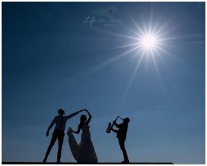 silhouette wedding photo bride and groom dancing saxophone Life in Focus Portraits wedding photographer Helensburgh Loch Lomond