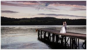 sunset wedding photo bride and grrom on pier Duck Bay Loch Lomond Life in Focus Portraits wedding photography Argyll and Bute