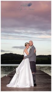 wedding photo of bride and groom on jetty Duck Bay Hotel Loch Lomond Life in Focus Porttraits wedding photographer Rhu Helensburgh