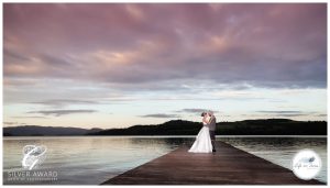 Wedding photo couple on pier Duck Bay Hotel Life in Focus Portraits award winning wedding photography Helensburgh Loch Lomond