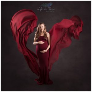 artistic pregnancy photography with flowing red dress Life in Focus Portraits maternity photoshoot Rhu Helensburgh Cove
