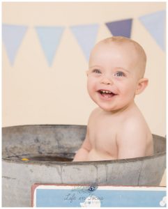 baby boy smiling in vintage bathtub Life in Focus Portraits baby photographer Arrochar Tarbet Luss