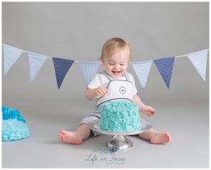 baby boy with 1st birthday cake Life in Focus Portraits Cake Smash photography Luss Balloch Aleaxandria