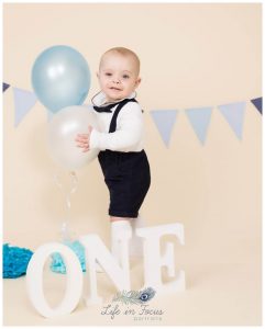 baby with balloons 1st Birthday photos Life in Focus Portraits first birthday photography sessions Rhu Helensburgh