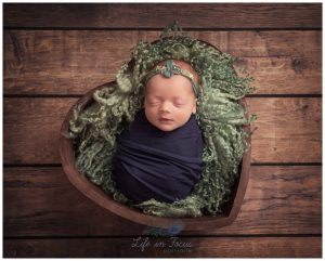 photo of newborn baby girl in heart Life in Focus Portraits newborn photography studio Rhu Helensburgh