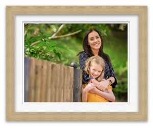 photo of mum and daughter in park smiling at photographer Life in Focus Portraits family photographer Rhu Helensburgh Dumbarton