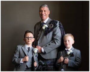 portrait photo of groom with page boys before wedding