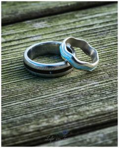 photo of wedding rings on wooden table Loch Lomond wedding